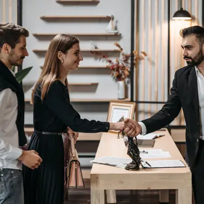 Lawyer shaking the client's hand.